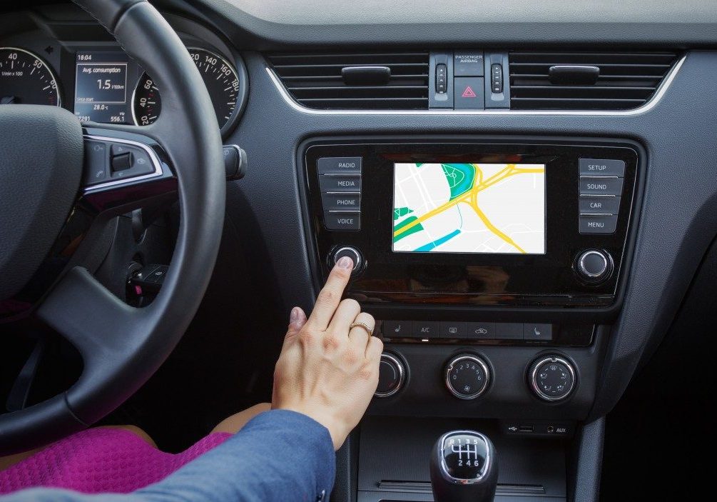 A driver navigating using a GPS device A driver navigating using a GPS device