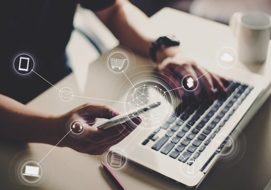 a photo of a person using his laptop and his phone with animations a photo of a person using his laptop and his phone with animations