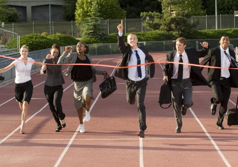 people dressed in corporate attire ran to the finish line people dressed in corporate attire ran to the finish line